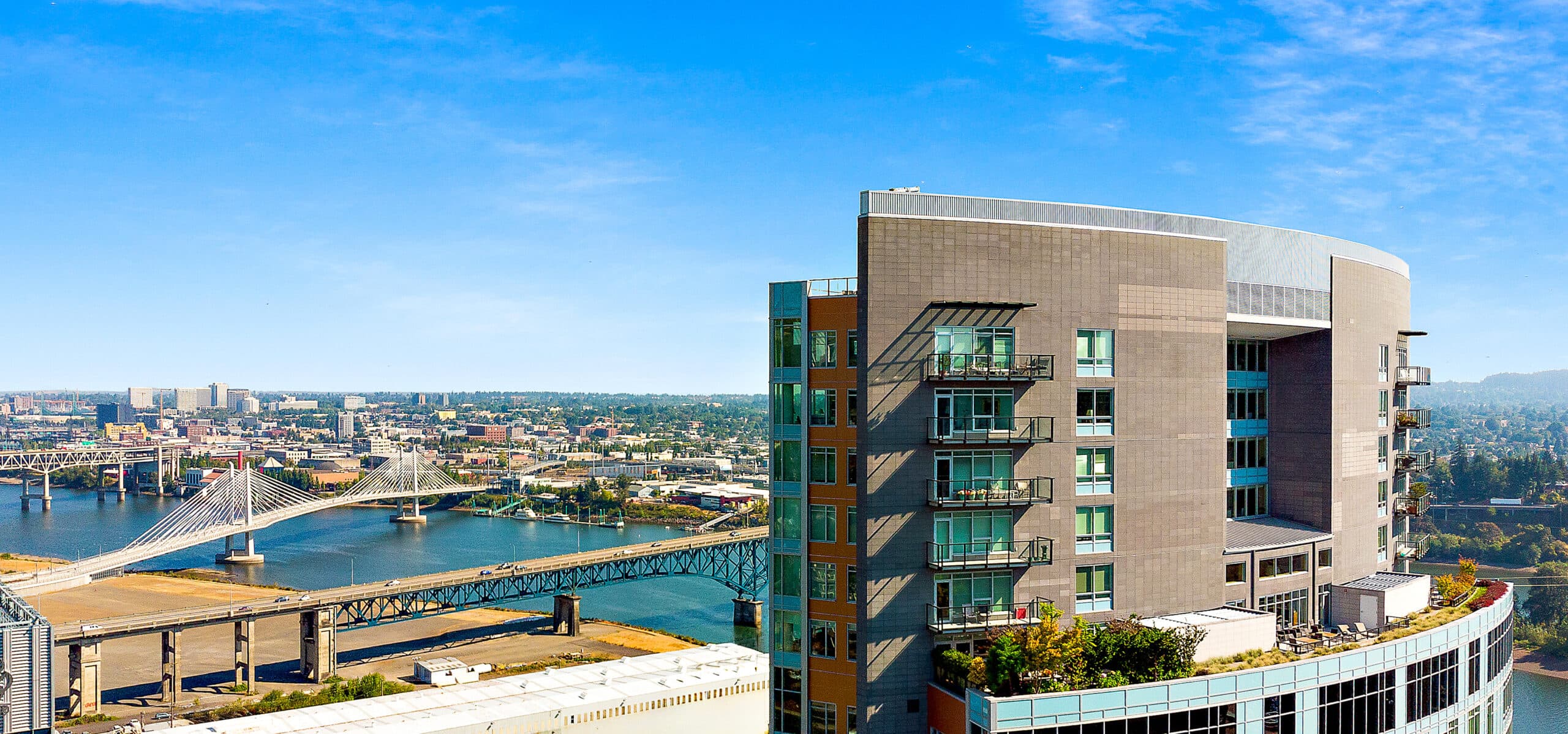 Aerial view of the Mirabella Portland building and surrounding skyline.